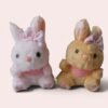 Llavero de peluche de conejito kawaii en colores rosa y amarillo con lazo